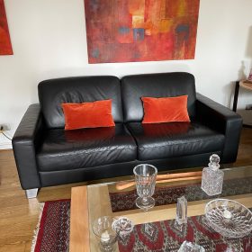 Sofá cuero negro Natuzzi