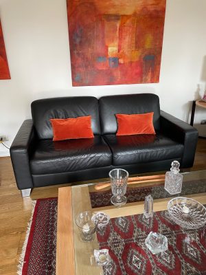 Sofá cuero negro Natuzzi